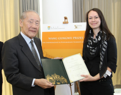  Ms Angharad Fletcher receives the prize from Professor Wang Gungwu